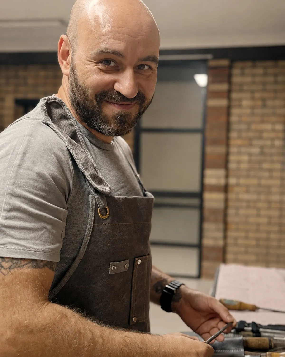 Viktor in the workshop with his chisel roll